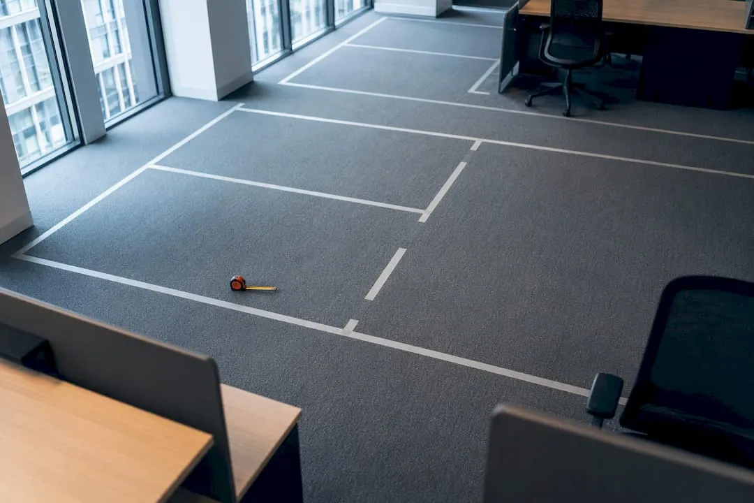 11 m³ Minimum and 150cm Capsules: UK Desk Spacing for Office Managers