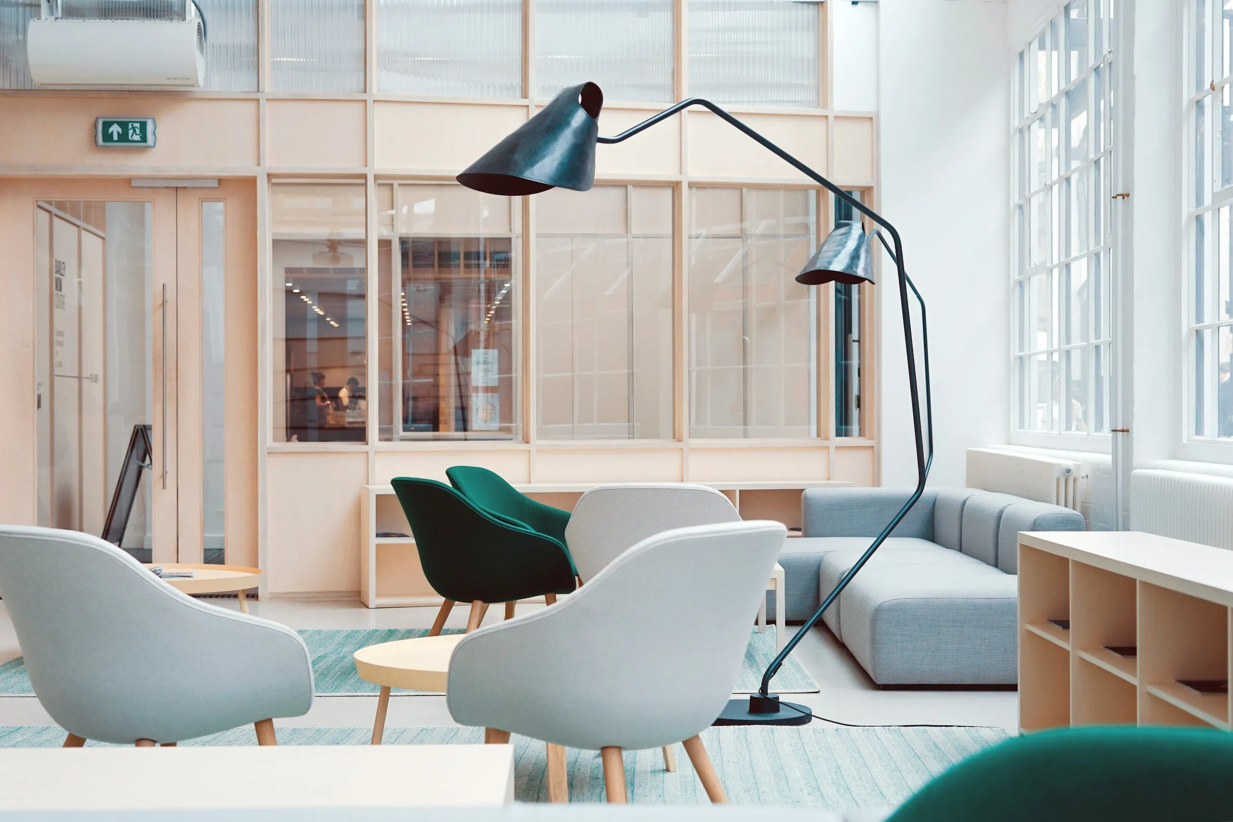 Breakout space with lounge chairs and a floor lamp