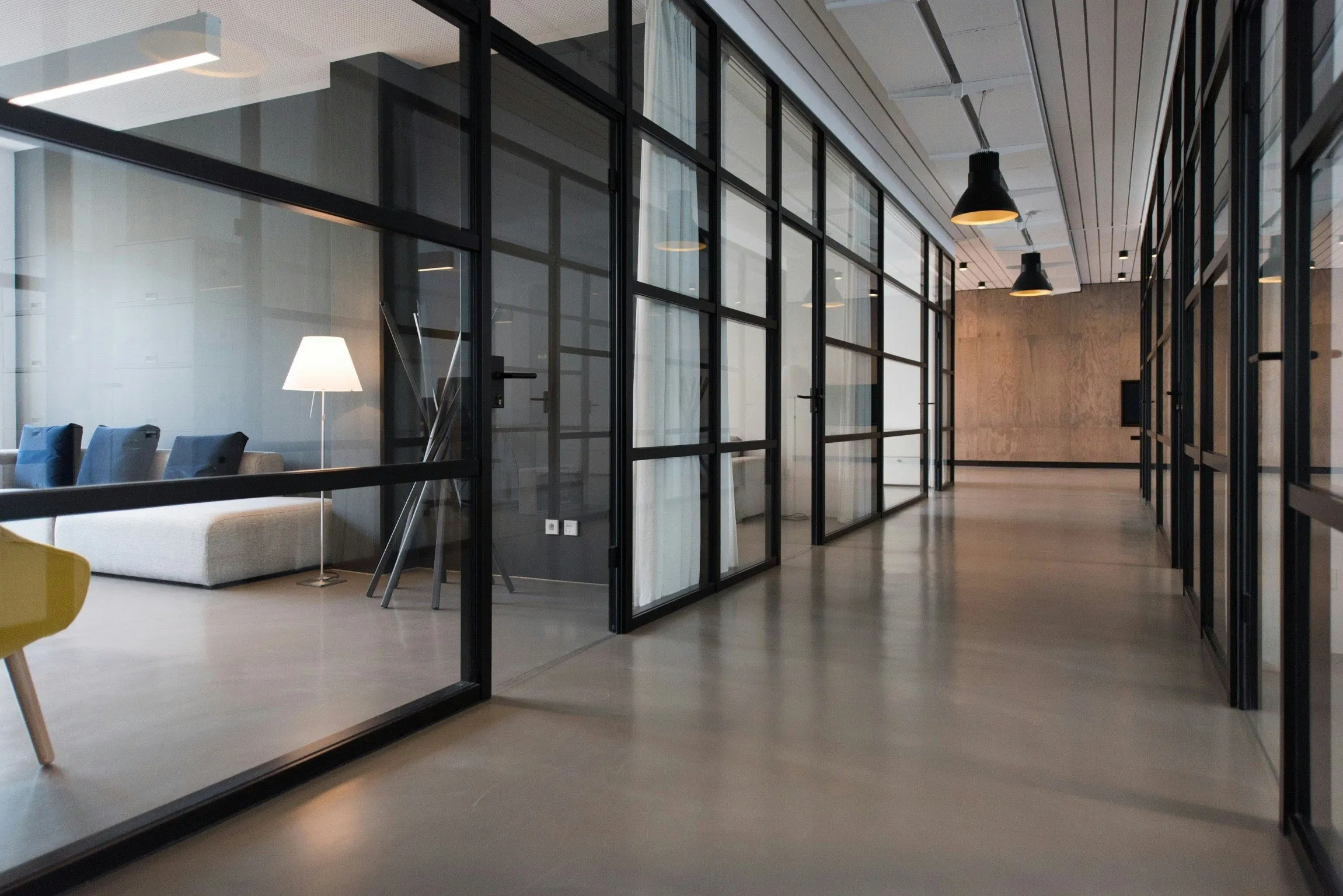 Office corridor with black steel glazed partitions