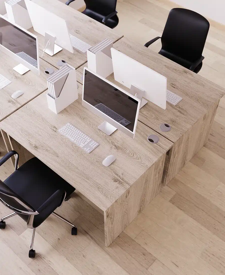 Oak effect bench desks with black chairs