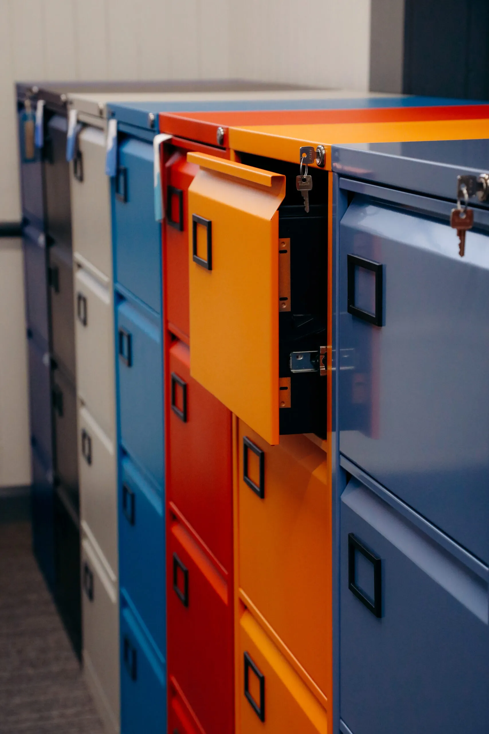 Grey, blue, red and orange steel filing cabinets