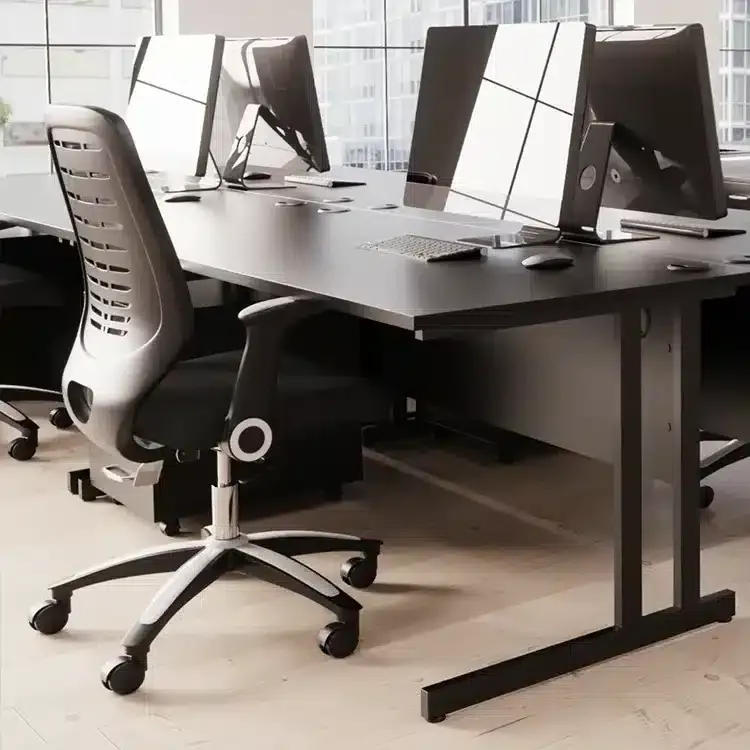 Black desk and black mesh office chair