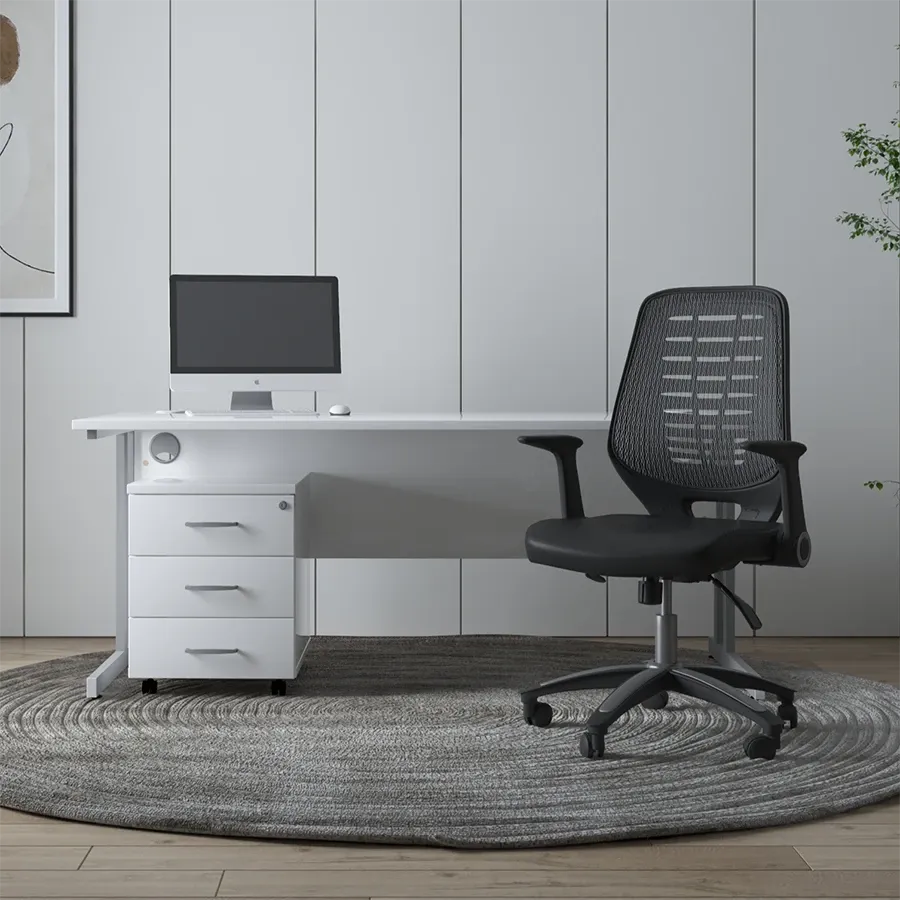 Black mesh-back operator chair at a white desk with a pedestal