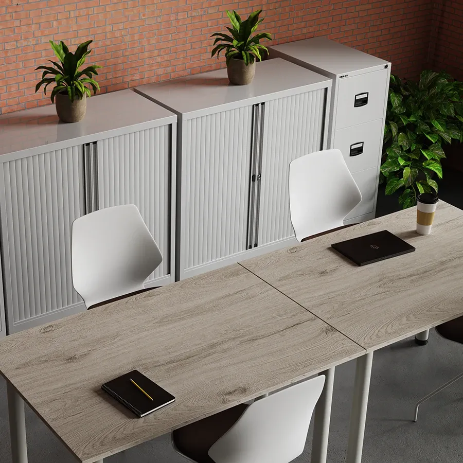 Grey oak table beside white tambour storage cupboards