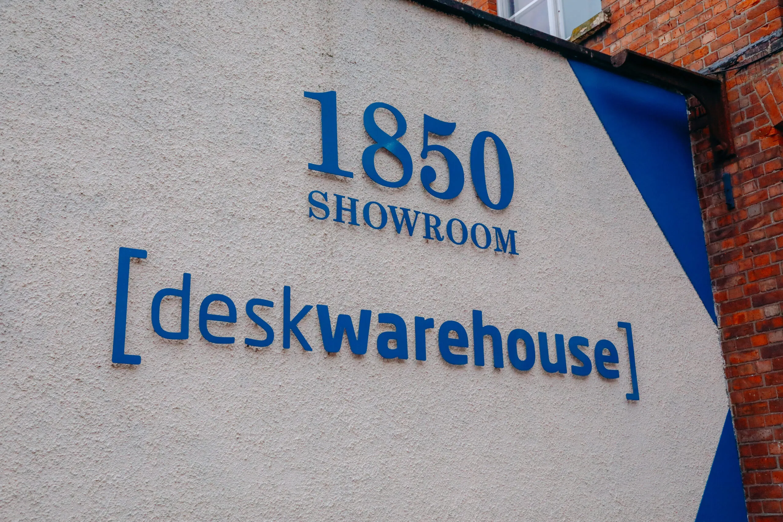 1850 Showroom Desk Warehouse sign on the mill wall