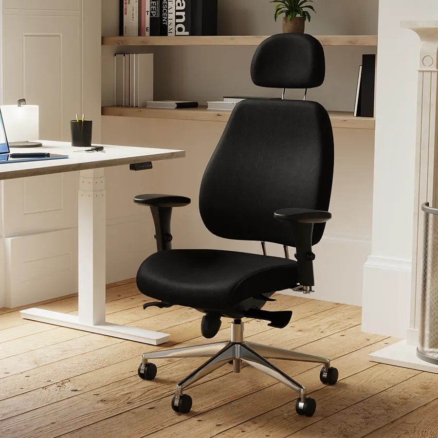 Black fabric posture chair at a white height adjustable desk