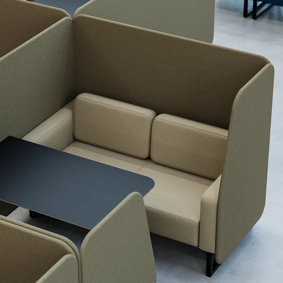 Olive green high-back booth seating with a black table