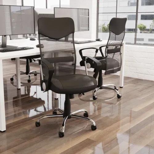 Black mesh office chairs at white bench desks