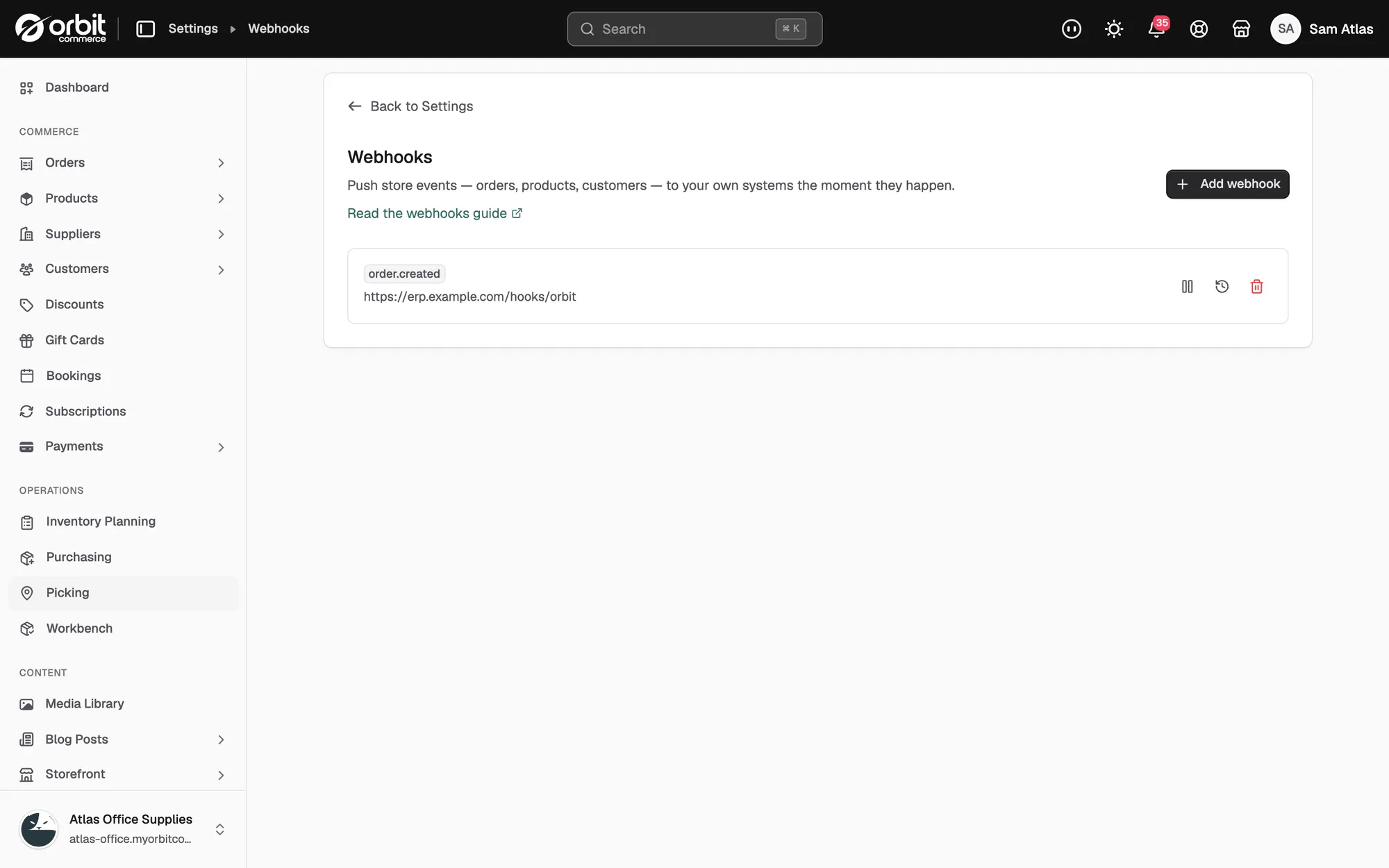 The Webhooks page with one webhook for order.created and its pause, delivery history and delete buttons.